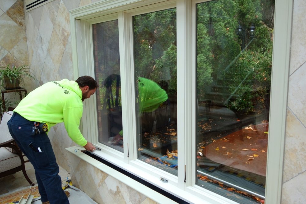 Interstate Lumber crew installing new windows in a home